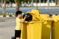 Boy carry garbage in bag for eliminate to the bin