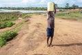 Boy carrying drinking water