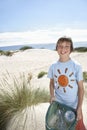 Boy Carrying Plastic Bag Filled With Garbage On Beach Royalty Free Stock Photo