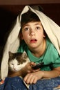 Boy with cat watch horror movie