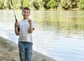 Boy catch fish on bait, child camping and fishing, river and forest, summer season