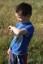 Boy with caterpillar on his arm