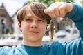 The boy caught a goby fish on a canal in Amsterdam Royalty Free Stock Photo