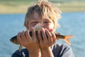 Boy caught grayling Royalty Free Stock Photo