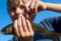 Boy caught grayling Royalty Free Stock Photo