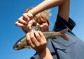 Boy caught grayling Royalty Free Stock Photo