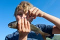 Boy caught grayling Royalty Free Stock Photo