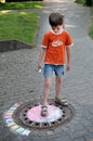 Boy chalking the street Royalty Free Stock Photo