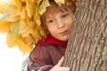 Boy with chaplet of yellow leaves