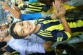 Boy cheering in soccer stadium