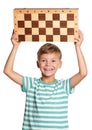 Boy with chessboard Royalty Free Stock Photo