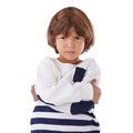 Boy, child and angry in portrait with arms crossed, frustrated and stress, emotion and frown on white background. Youth Royalty Free Stock Photo