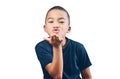Boy child, blowing air kiss and happy portrait for flirting, motivation or love. Inspiration, hand gesture and latino