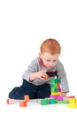 Boy child building kids block tower isolated Royalty Free Stock Photo