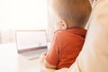 Boy child enthusiastically watching video blog or cartoons on laptop screen. Concept myopia, internet addiction Royalty Free Stock Photo