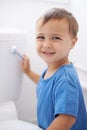 Boy child, flush toilet and potty training for smile, portrait or pride for development in family home. Kid, bathroom Royalty Free Stock Photo