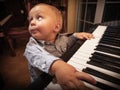 Boy child kid playing on digital keyboard piano synthesizer Royalty Free Stock Photo