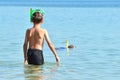 Boy child in a mask with a tube on the beach. children`s swimming lessons . school Kids diving. Royalty Free Stock Photo