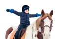 A boy child rides a horse in winter through a snowy forest, isolated Royalty Free Stock Photo