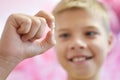 Boy child with a torn out tooth. Dental office for child. Loss of milk teeth. Royalty Free Stock Photo