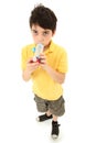 Boy Child Using Asthma Inhaler with Spacer Chamber