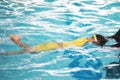 Boy child practice swimming with trainer Royalty Free Stock Photo