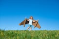 Boy child with wings at sky imagines a pilot and dreams of flying. Royalty Free Stock Photo