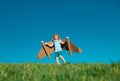 Boy child with wings at sky imagines a pilot and dreams of flying. Royalty Free Stock Photo