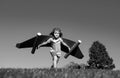 Boy child with wings at sky imagines a pilot and dreams of flying. Kids adventure, children freedom and imagination Royalty Free Stock Photo