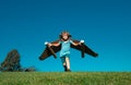 Boy child with wings at sky imagines a pilot and dreams of flying. Kids adventure, children freedom and imagination Royalty Free Stock Photo