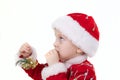 Boy in christmas clothes with toys