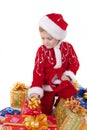 Boy in christmas clothes with toys