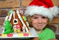 Boy and Christmas gingerbread house