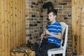 Boy with a clarinet plays music. Online music lesson concept