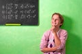 Boy in classroom with wondering expression Royalty Free Stock Photo