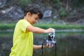 Boy cleans camera with foam