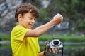 Boy cleans CMOS image sensor in digital camera