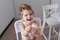 Boy cleans his teeth in the morning and plays with a toothbrush