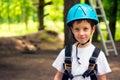 boy at climbing activity in high wire forest park