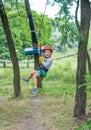 Boy at climbing activity in high wire forest park. Table Mountain Cableway kids special on again. Royalty Free Stock Photo