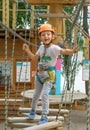 Boy at climbing activity in high wire forest park. Table Mountain Cableway kids special on again. Royalty Free Stock Photo