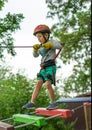 Boy at climbing activity in high wire forest park. Table Mountain Cableway kids special on again. Royalty Free Stock Photo