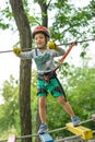 Boy at climbing activity in high wire forest park. Table Mountain Cableway kids special on again. Royalty Free Stock Photo
