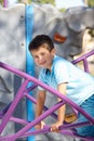 Boy On Climbing Frame In Park Royalty Free Stock Photo