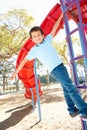 Boy On Climbing Frame In Park Royalty Free Stock Photo