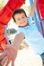 Boy On Climbing Frame In Park Royalty Free Stock Photo