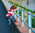 Boy climbing over the fence Royalty Free Stock Photo