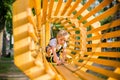 Boy climbing pass obstacles in rope park Royalty Free Stock Photo