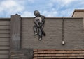 `Boy Climbing`, a public art piece in Deep Ellum in East Dallas, Texas, by Joe Iurato.