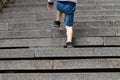 Boy climbing stairs stone - symbol of success